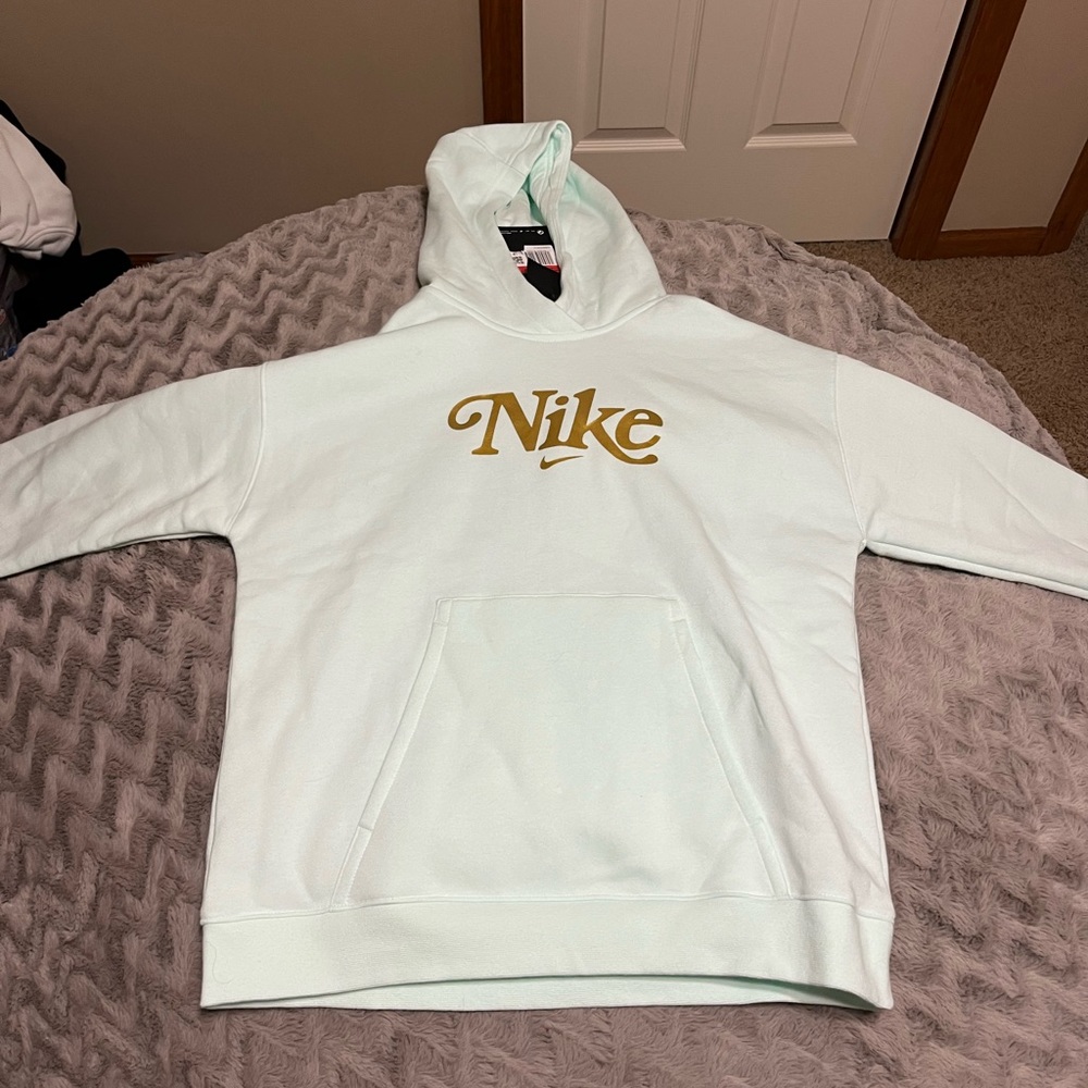 light teal nike sweatshirt in a kids large